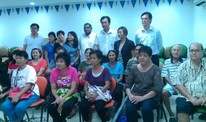 Tan, Yap and Tnay with the people they helped.