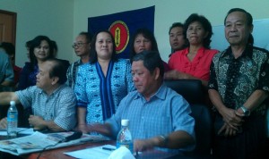 Nogeh seated far right with his supporters