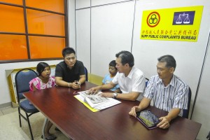 The father of two listening to SUPP PCB Bureau Chief Wilfred Yap. To his right is PCB Committee member, Cr. Yeo Eng Kwang