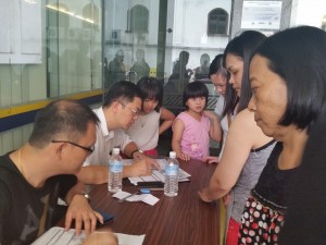 Robert Lau attending to Brim application