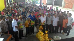 Francis in Blue BN shirt with the people . 