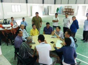 Dr. Sim with the community leaders at the hall.