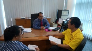 SUPP PCB Chief and candidate for N12 Kota Sentosa Wilfred Yap with the widow meeting an officer at SOCSO office