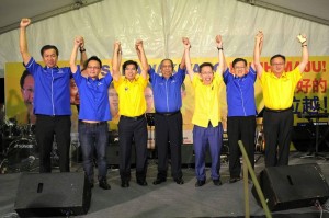 Dr Sim centre with his team