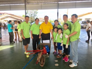 Lo in yellow, joining in the gotong royong.