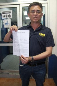 Tan Kai after lodging the police report Monday night.