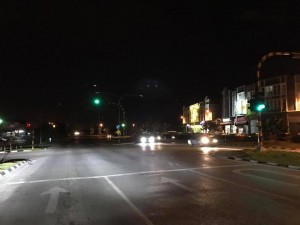 The street in darkness.