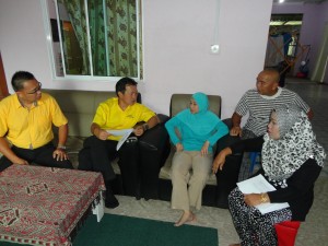 SUPP PCB Chief Wilfred Yap with the woman seeking assistance from SUPP  at her house at BDC Resettlement Scheme, Kuching