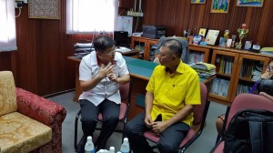 Ting  in a discussion with Dr. Jack Wong