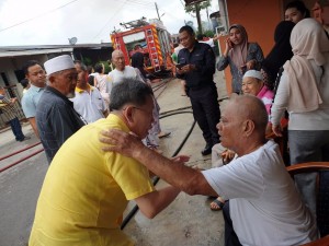 Dr Sim comforting the victims