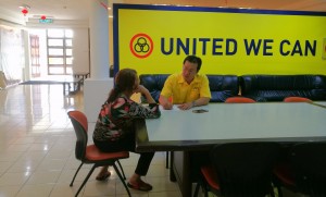 Yap with the single mother seeking assistance on her son's problem with moneylender