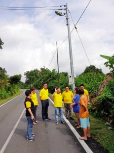Dr Sim looking at the new street lights.
