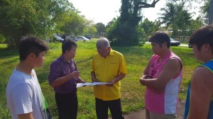 Datuk Sebastian Ting looking at the plan of the shed
