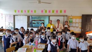 Ting distributing the mask.