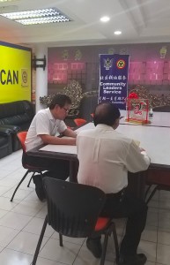 Yap together with the father seeking assistance on his daughter's problem  at SUPP office.