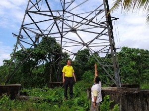 Yap and Mr Tan at the site of Tower Base of the transmission tower.