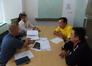Yap and Mr Tan during the meeting with officers of the power utility company.